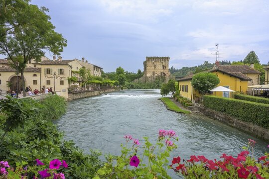 View from the bridge over the Mincio river in the background part of the Visconti bridge from 1395, Borghetto, Valeggio sul Mincio, province of Verona, Italy