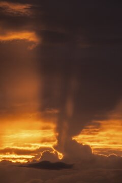 Rays of sunshine penetrate from behind storm clouds, dramatic lighting mood, Germany