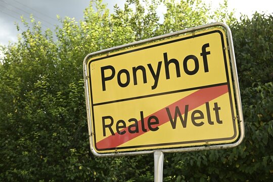 Pony farm versus real world sign, Baden-W&uuml;rttemberg, Germany