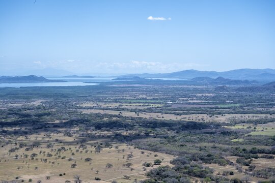 View over dry plain to the sea, Mirador Nacaome, Barra Honda National Park, Costa Rica