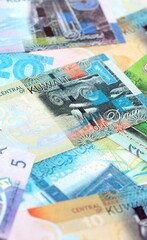 Kuwaiti dinar currency money bills. The current banknotes lies on table in big amount close up