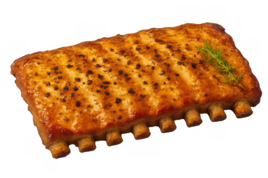 Rack of oven-baked pork ribs seasoned with spices and a sprig of dill, ready to eat. Transparent background