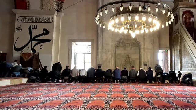 people in the hall of a mosque