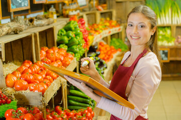 a woman is writing on the board