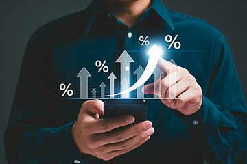 Percentage increase growth chart concept businessman analyzing financial data on mobile phone screen trend