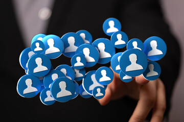 Hand holding a network of people icons, representing social connections, teamwork and global...