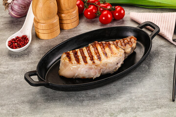 Grilled pork loin steak with bone