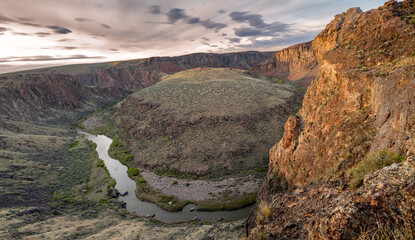 Horseshoe bend in the Owyhee River at sunset