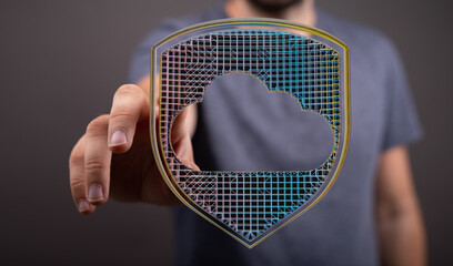 Hand holding a digital shield with a cloud shape, representing cybersecurity, data storage, and...