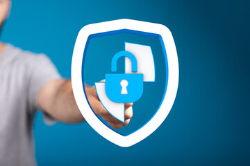 Hand holding a shield with a lock, symbolizing data security and privacy protection. Concept for digital safety, online protection, a