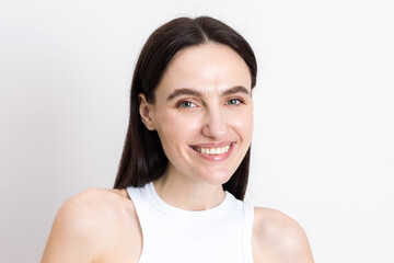 Young woman enjoying her skincare routine with a focus on natural beauty
