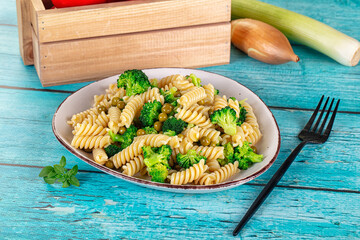 Italian vegan pasta fusilli with broccoli