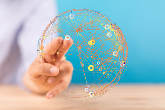 Hand reaching towards a globe representing global connection and networking. Concepts of communication, digital transformation and in