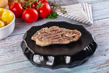 Grilled lamb steak with bone