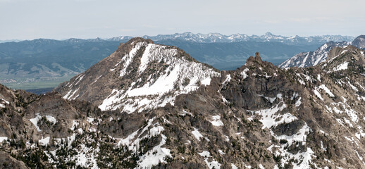 Mountain range with closeup of tall mountain peak