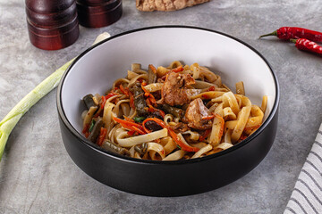 Asian cuisine udon with chicken and vegetables