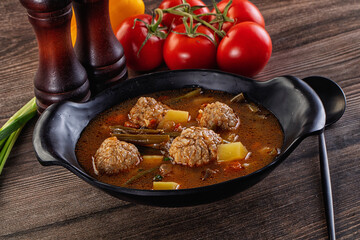 Tomato Soup with meatballs and vegetables