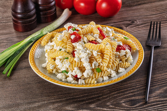 Italian pasta fusili with curd