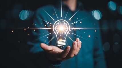 Businessman holding half of virtual lightbulb and brain on blue bokeh background , Smart thinking idea and inspiration innovation concept. brainstorm