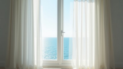 Sheer white curtains blow gently in the breeze through an open window with a sea view.

