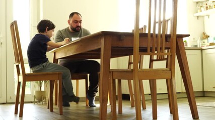 Father and son are having dinner, time together