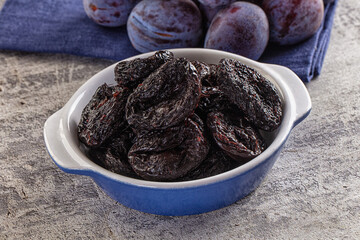 Black dry sweet prunes heap