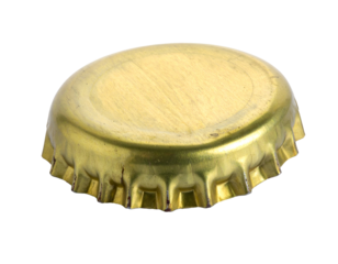 Golden crown bottle cap turned upside down, metal beer or soda closure with crimped rim on isolated background