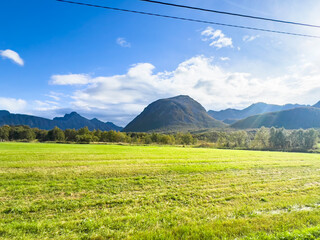 Obraz premium Autumn landscape in Lofoten Islands, Northern Norway, featuring colorful foliage, and a peaceful fjord.