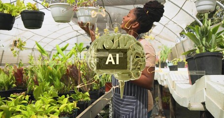 Inspecting woman wearing striped apron checking hanging white planter at nursery bench, AI overlay