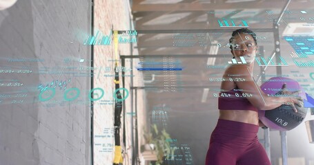 Holding purple medicine ball, woman in maroon workout set standing in gym, HUD overlays, copy space