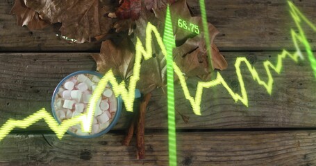 Displaying mug with marshmallows on wood table at park, showing leaves, cinnamon, neon graph 68 © vectorfusionart