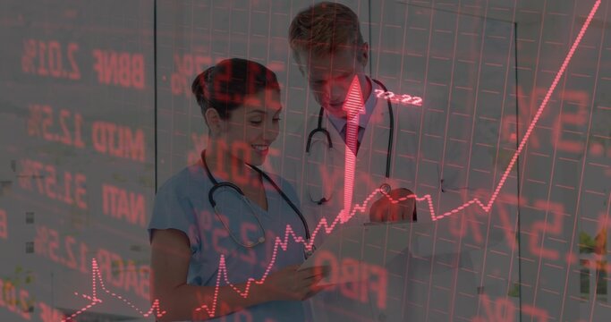 Two medics examining tablet in clinic wearing scrubs lab coat stethoscopes and red chart overlay