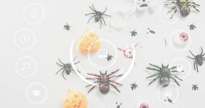 Showing red-accented black toy spider sitting centered on pale table, with Halloween props and HUD