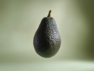 Ripe dark green Hass avocado fruit isolated on a pale green backdrop studio