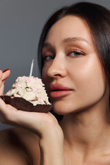 Beauty portrait of a pretty girl with a cake 