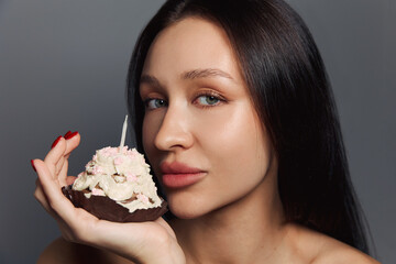 Beauty portrait of a pretty girl with a cake 