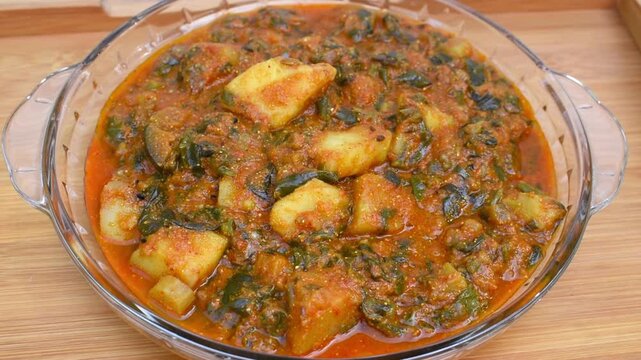 aloo poi saag sabji means potato malabar spinach curry.