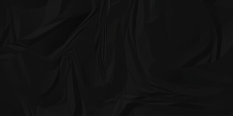 Dark black page wrinkle cardboard crumpled satin fabric ripped cloth decoration background	
