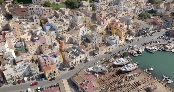 Aerial view of a small seaside village. The houses are located on the waterfront of Sciacca, in the province of Agrigento, Sicily, Italy. It overlooks Mediterranean Sea.
