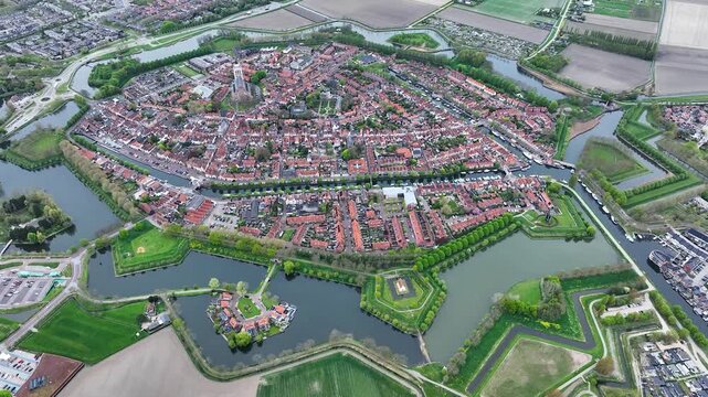 Aerial views of the historic fortified  town of Brielle, Den Briel, The Netherlands. View from the drone of star-shaped Fort Brielle showcasing canals, historic architecture, and vibrant cityscape