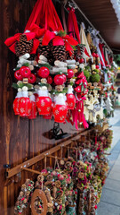 Wooden and metal multi-colored Christmas garlands and wreaths for decorating house at Christmas Market. Christmas in Germany.