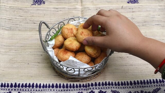 Mini Kachori Served in rustic basket, Indian Snack or Tea Time Food