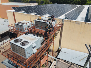 Industrial air conditioning repair technicians at work