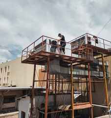 Industrial air conditioning repair technicians at work
