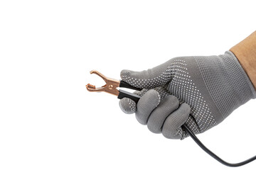 Hand wearing gray glove holds opened alligator clip with black cable, isolated on white background. image conveys sense of readiness and precision