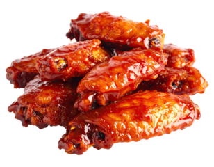 Close-up of saucy, glistening, fried chicken wings piled on each other