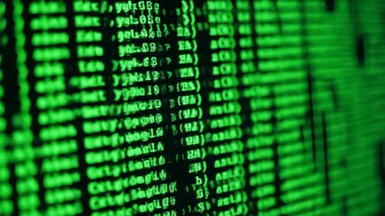 Closeup of green glowing computer code scrolling rapidly on a dark screen depicting a dynamic digital interface with abstract data and programming language in a futuristic cyber environment. - Powered by Adobe