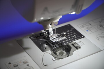 Stylish sewing machine glowing with neon colors