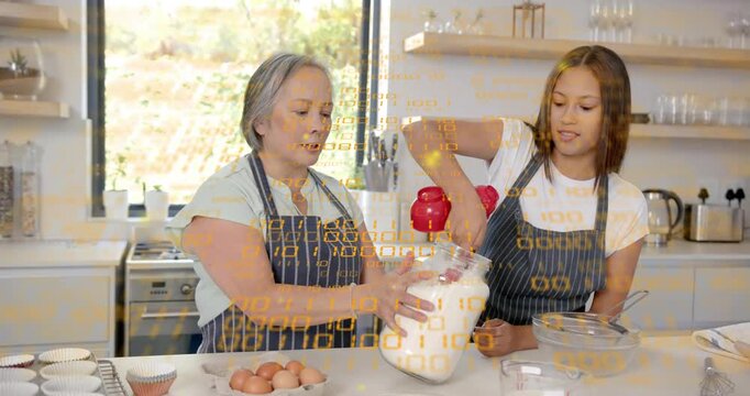 Teenager reaching with red measuring cup, pouring into clear jar while adult steadying for baking