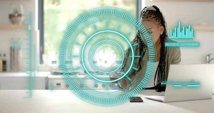 Woman working remotely on laptop, reaching for glass cup, sipping to stay focused under teal HUD